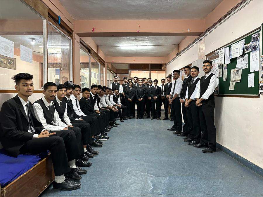 BIHM students lined up in uniform, corridor